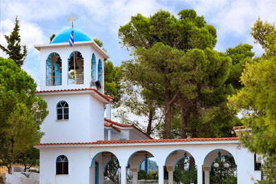 Exterior of the traditional white-blue greek bell tower of a christian orthodox temple in loutraki.