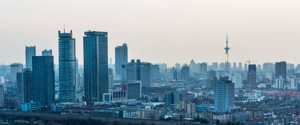 Modern buildings in city against sky