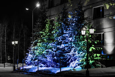 Low angle view of illuminated street light at night