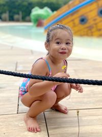 Portrait of cute baby girl sitting