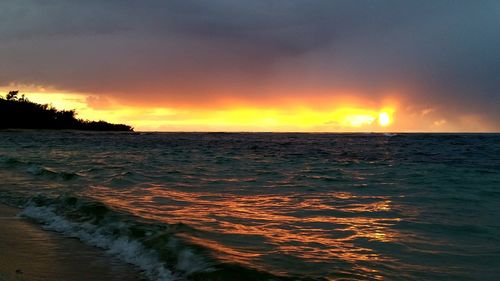 Scenic view of sea at sunset