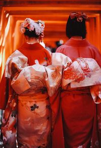 Rear view of women in traditional clothing