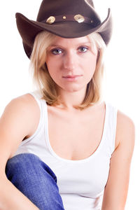 Pretty western woman in hat closeup on white background