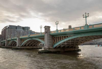 Bridge over river against sky