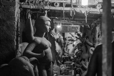 Rear view of woman standing in store