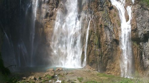 Scenic view of waterfall in forest