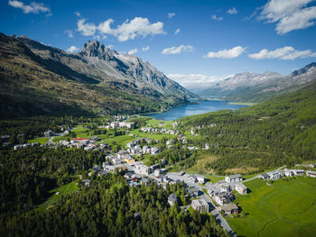 Aerial image of maloja village and mountain pass road, engadin, switzerland