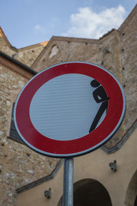 Low angle view of road sign against sky