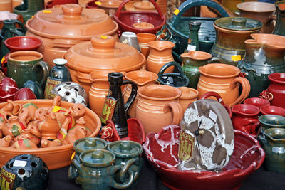 High angle view of handmade earthenware pot containers for sale