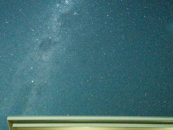 Night milkyway stars over roof