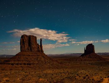 Rock formations on landscape against sky