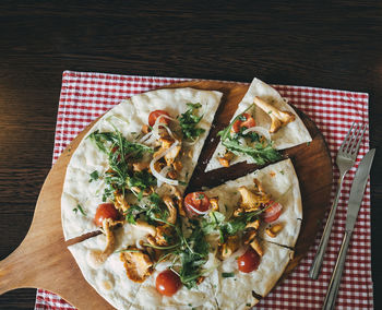 High angle view of pizza in plate on table