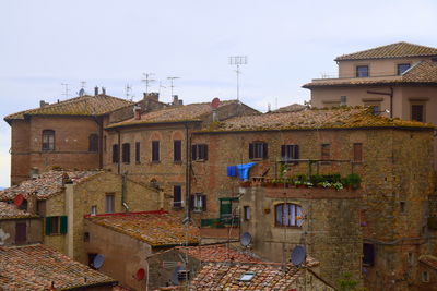 Houses in town against clear sky