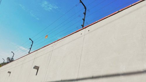 Low angle view of built structure against blue sky