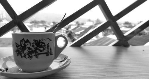 Close-up of coffee cup on table