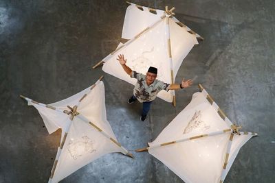 High angle view of man holding umbrella