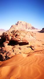 Rock formations in desert against clear sky