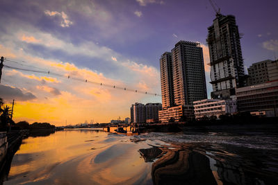 City skyline against sky during sunset