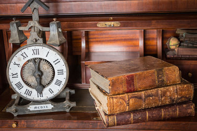 Close-up of clock on table