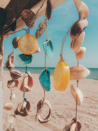Close-up of lanterns hanging on beach