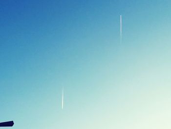 Low angle view of vapor trails in sky