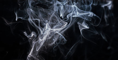 Close-up of smoke against black background