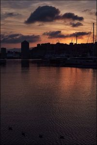 Bridge over sea at sunset