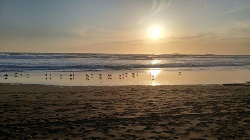 Scenic view of sea against sky at sunset