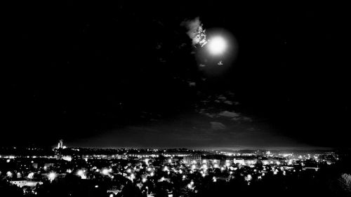 Illuminated fireworks against sky at night