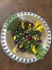 High angle view of flowers in plate on table