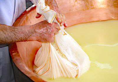 Close-up of hand holding ice cream