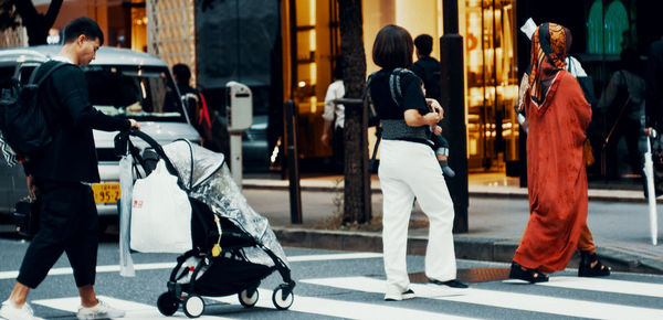 People walking on street in city