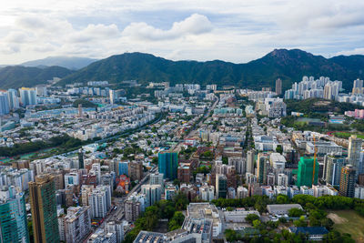 High angle view of buildings in city against sky