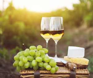 Close-up of grapes in glass on table