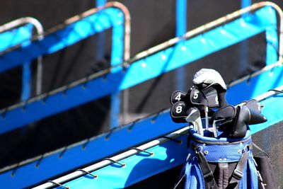 Close-up of bicycle against blue wall