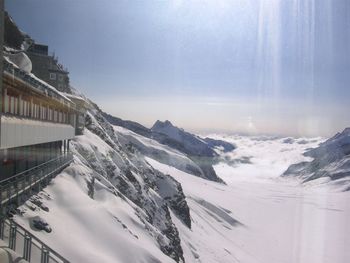 Scenic view of snow mountains against sky