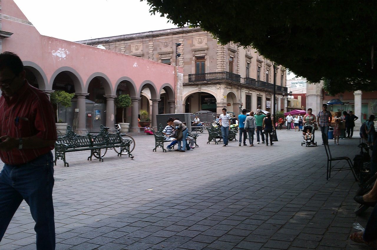 architecture, men, building exterior, built structure, street, walking, person, lifestyles, transportation, bicycle, large group of people, land vehicle, city, leisure activity, mode of transport, city life, travel, full length, cobblestone