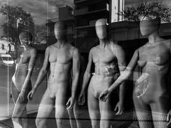 Digital composite image of statues in store