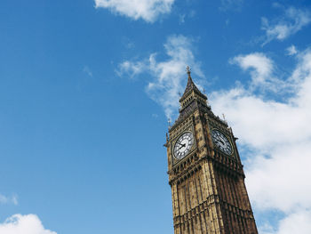 Low angle view of clock tower against sky