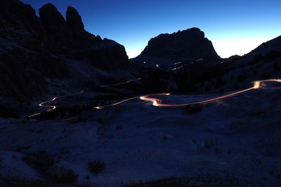 Scenic view of mountains against sky at night