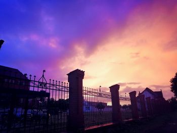 Silhouette buildings against sky during sunset