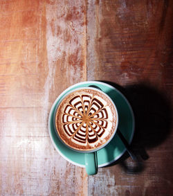 Directly above shot of coffee cup on table