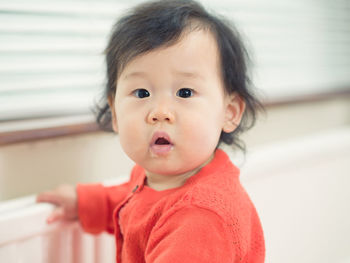 Portrait of cute baby at home