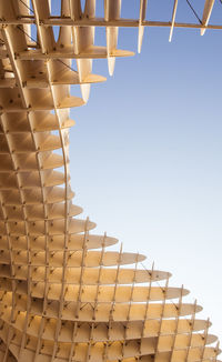 Low angle view of office building against clear sky