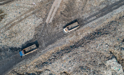 High angle view of abandoned cars on road