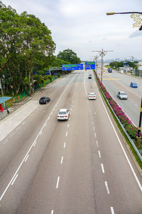 Cars on road against sky