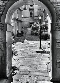 Arch bridge in front of building