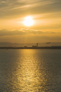 Scenic view of sea against sky during sunset