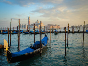 Gondola on grand canal against church of san giorgio maggiore in city