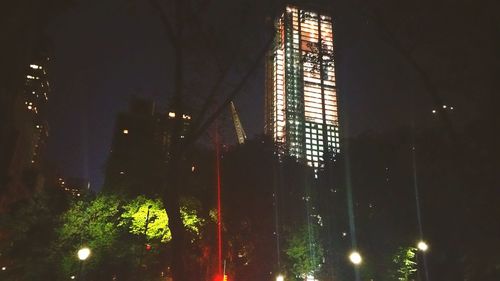 Low angle view of illuminated street light at night